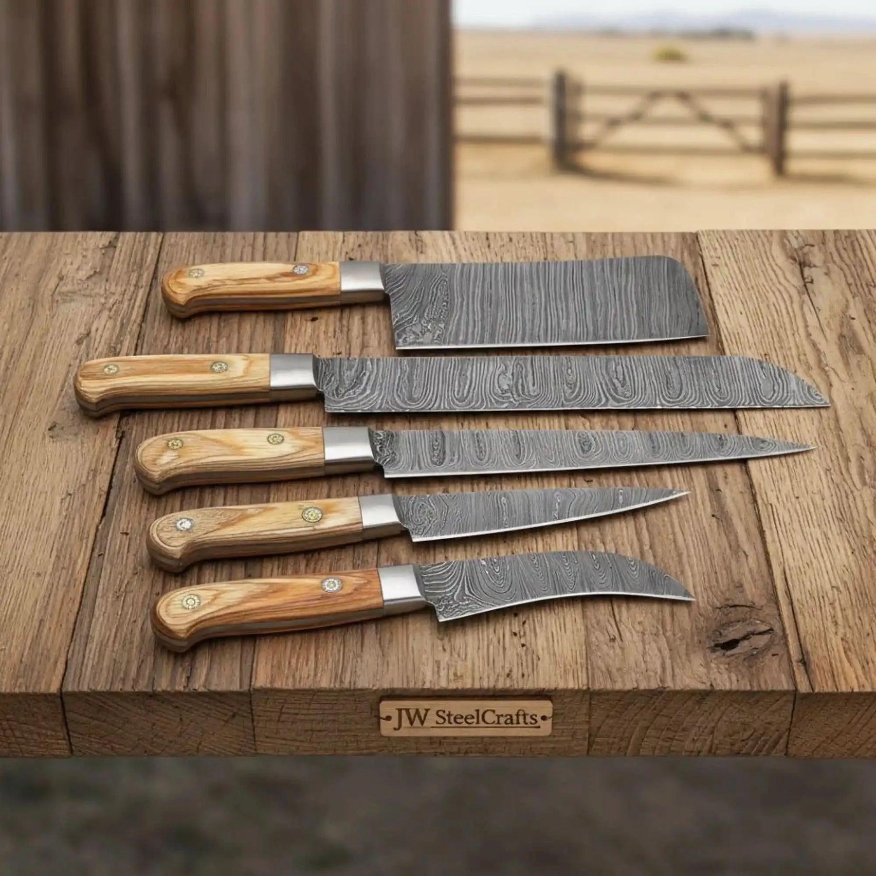 Handmade damascus steel knife with wood handle on dark surface