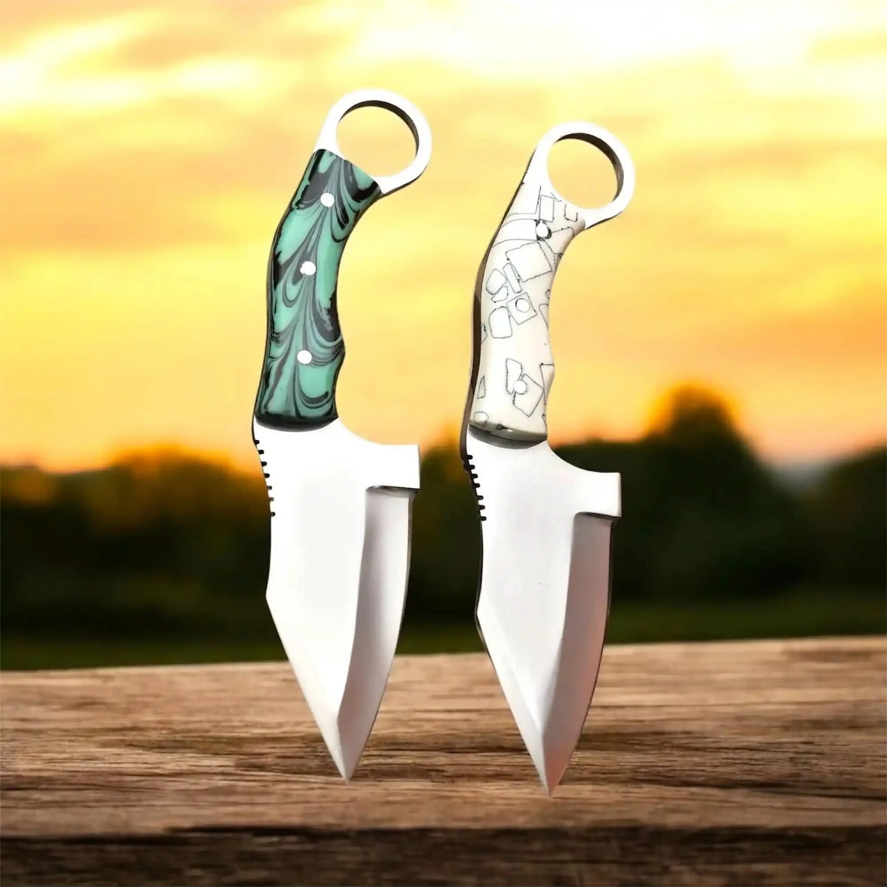 Handmade stainless steel steel knife with resin handle on dark surface
