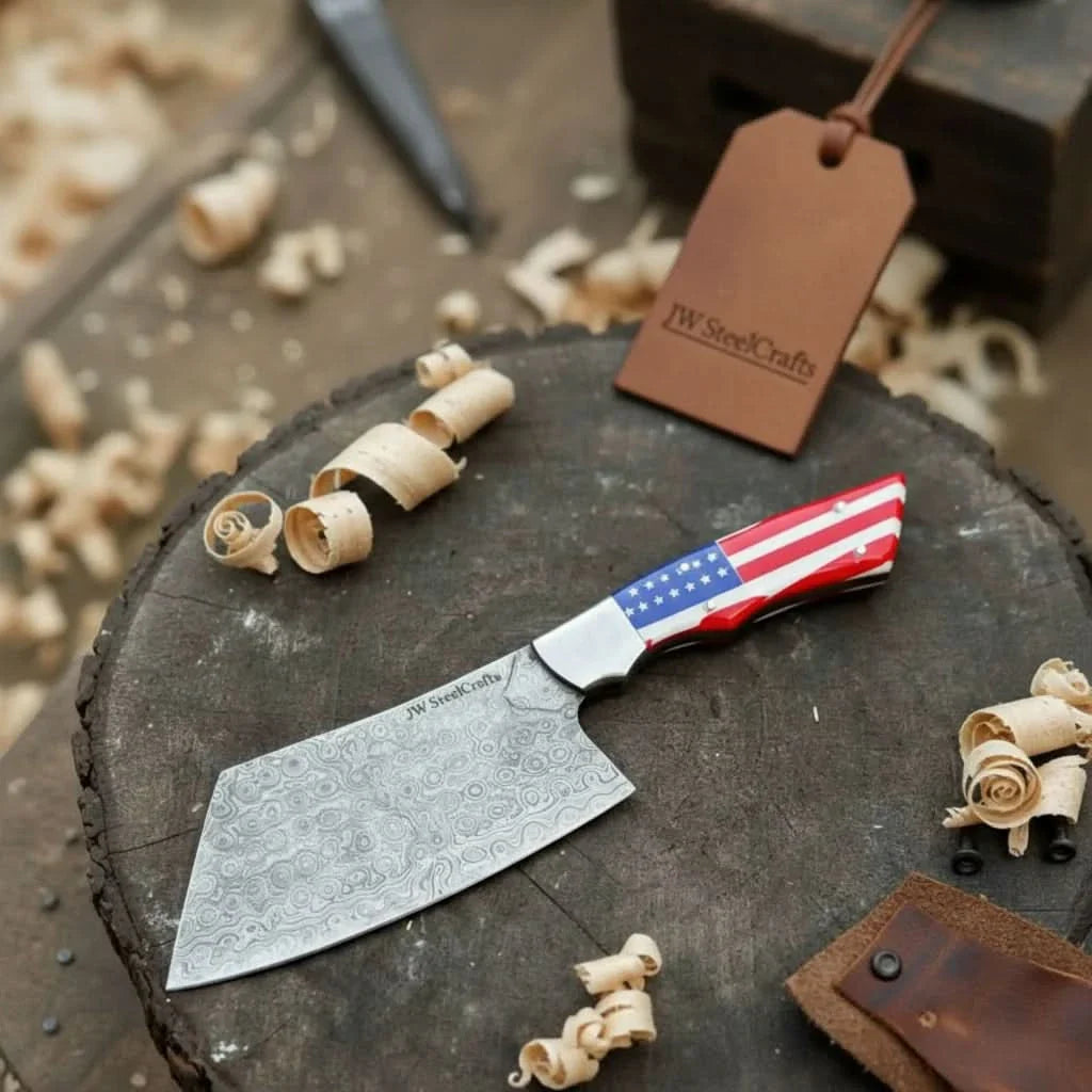 Handmade damascus steel knife with premium handle on dark surface