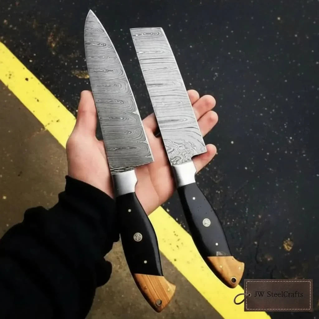 Handmade damascus steel knife with wood handle on dark surface