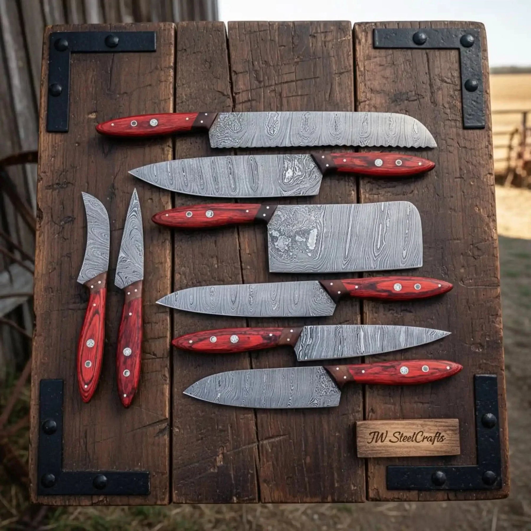 Handmade damascus steel knife with premium handle on dark surface