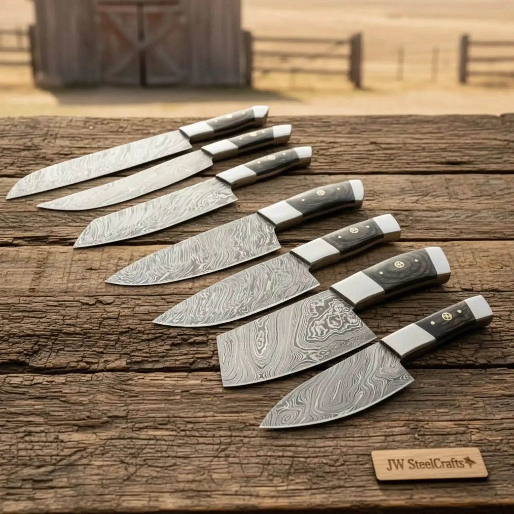 Handmade damascus steel knife with wood handle on dark surface
