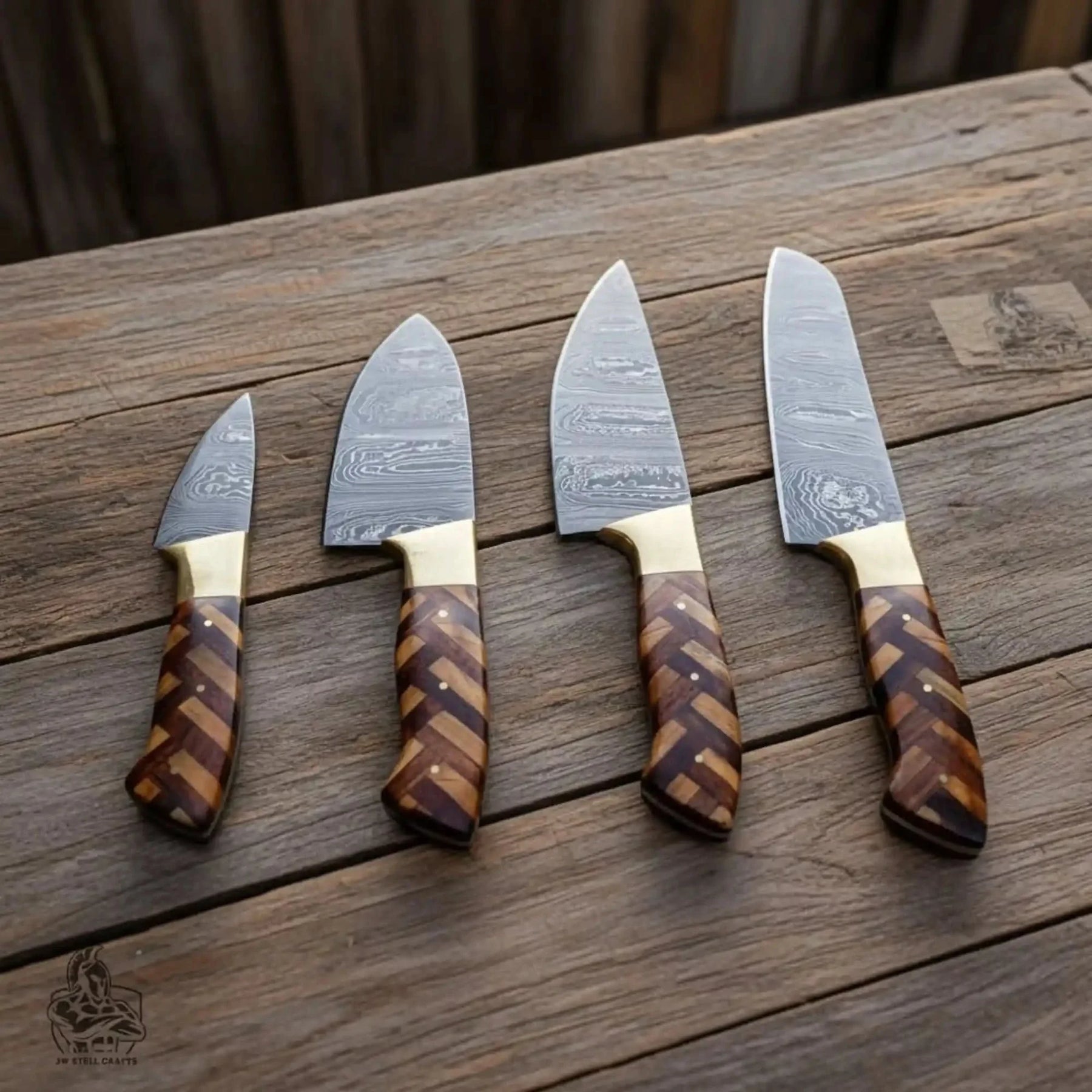 Handmade damascus steel knife with wood handle on dark surface