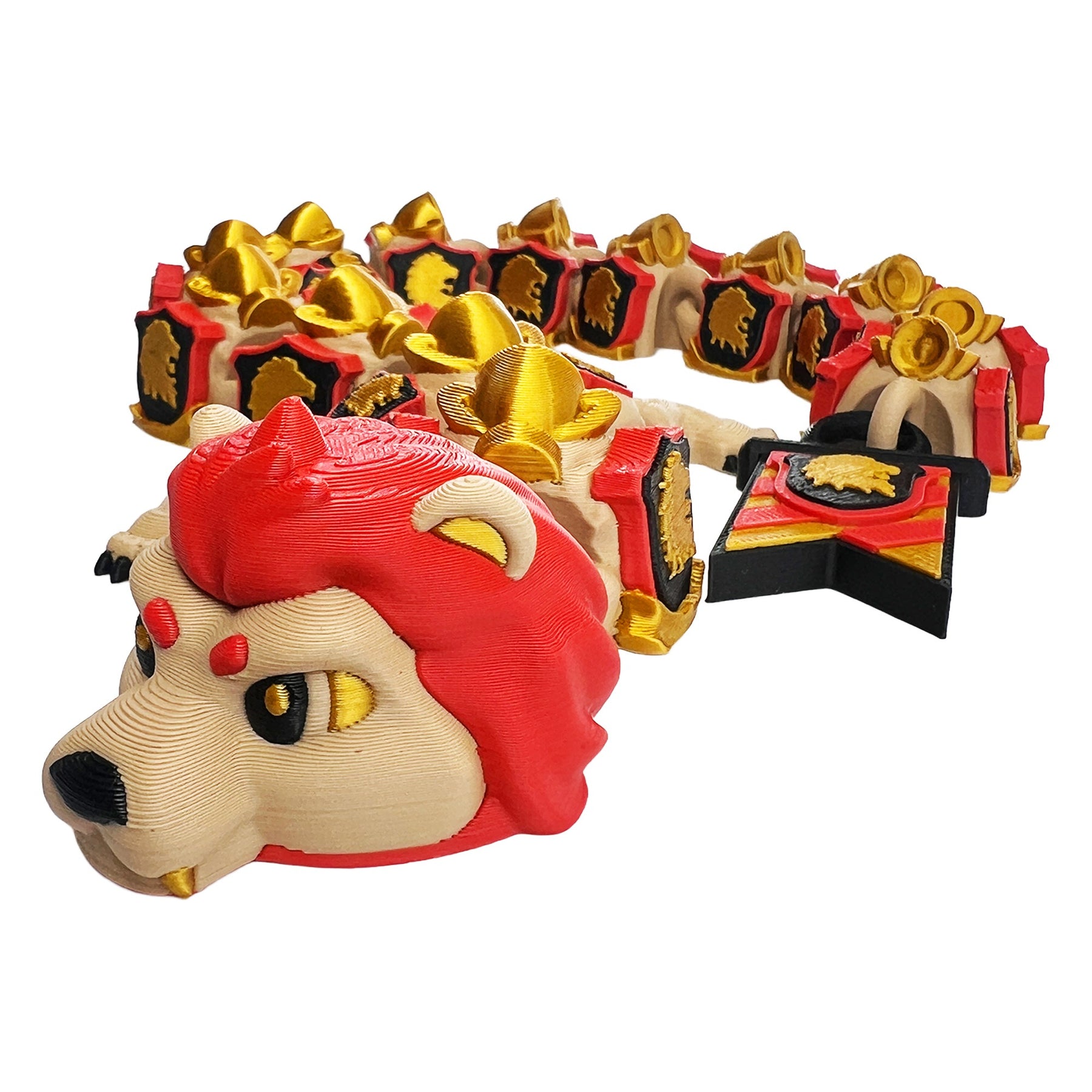 Professor Lion Dragon articulated 3D printed flexi dragon curled beside its red, gold, and black banner tail