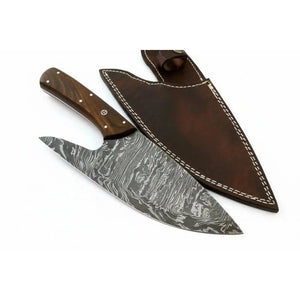 Handmade damascus steel knife with wood handle on dark surface