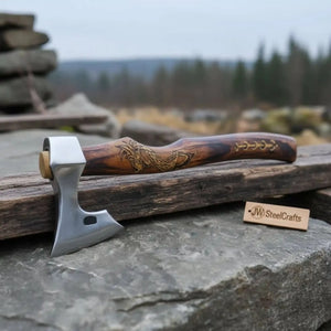 Damascus steel axe head with wood handle on rustic wood surface