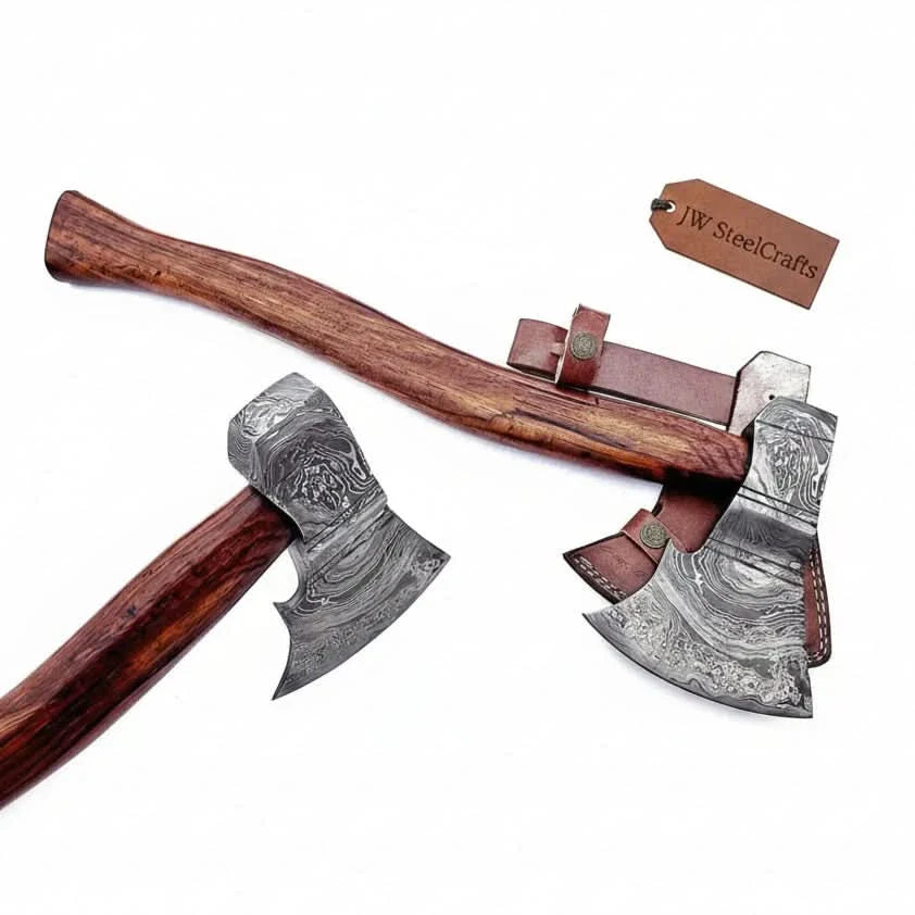 Damascus steel axe head with wood handle on rustic wood surface