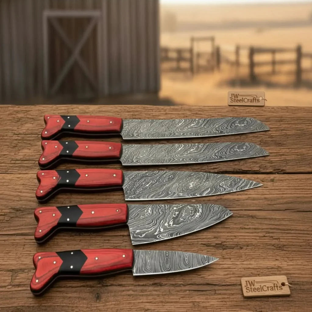 Handmade damascus steel knife with wood handle on dark surface