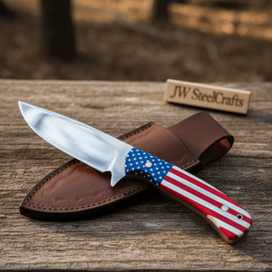 Handmade damascus steel knife with premium handle on dark surface