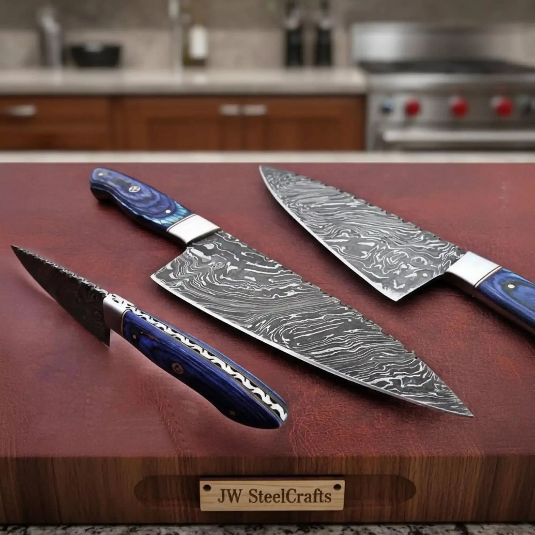 Handmade damascus steel knife with wood handle on dark surface