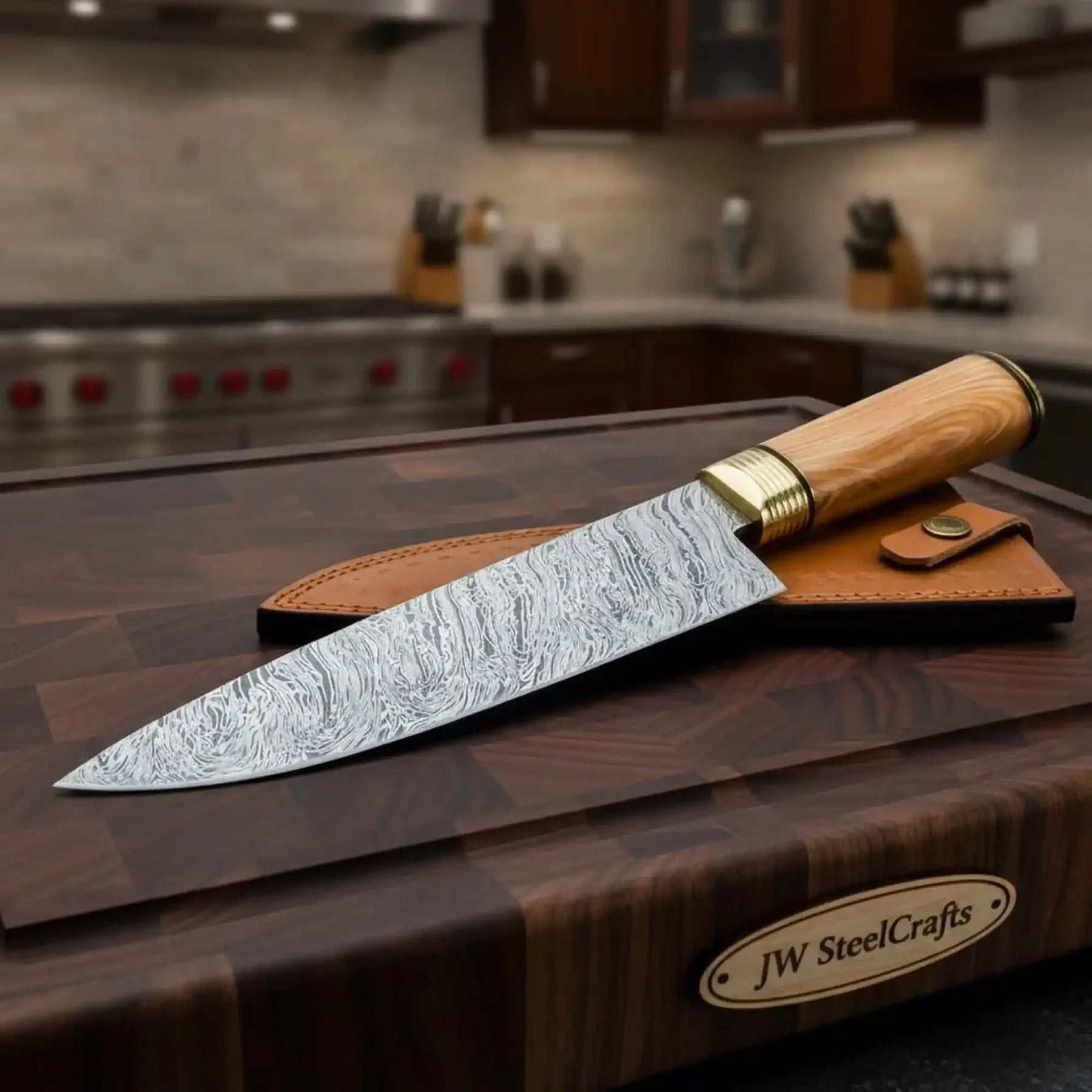 Handmade damascus steel knife with wood handle on dark surface