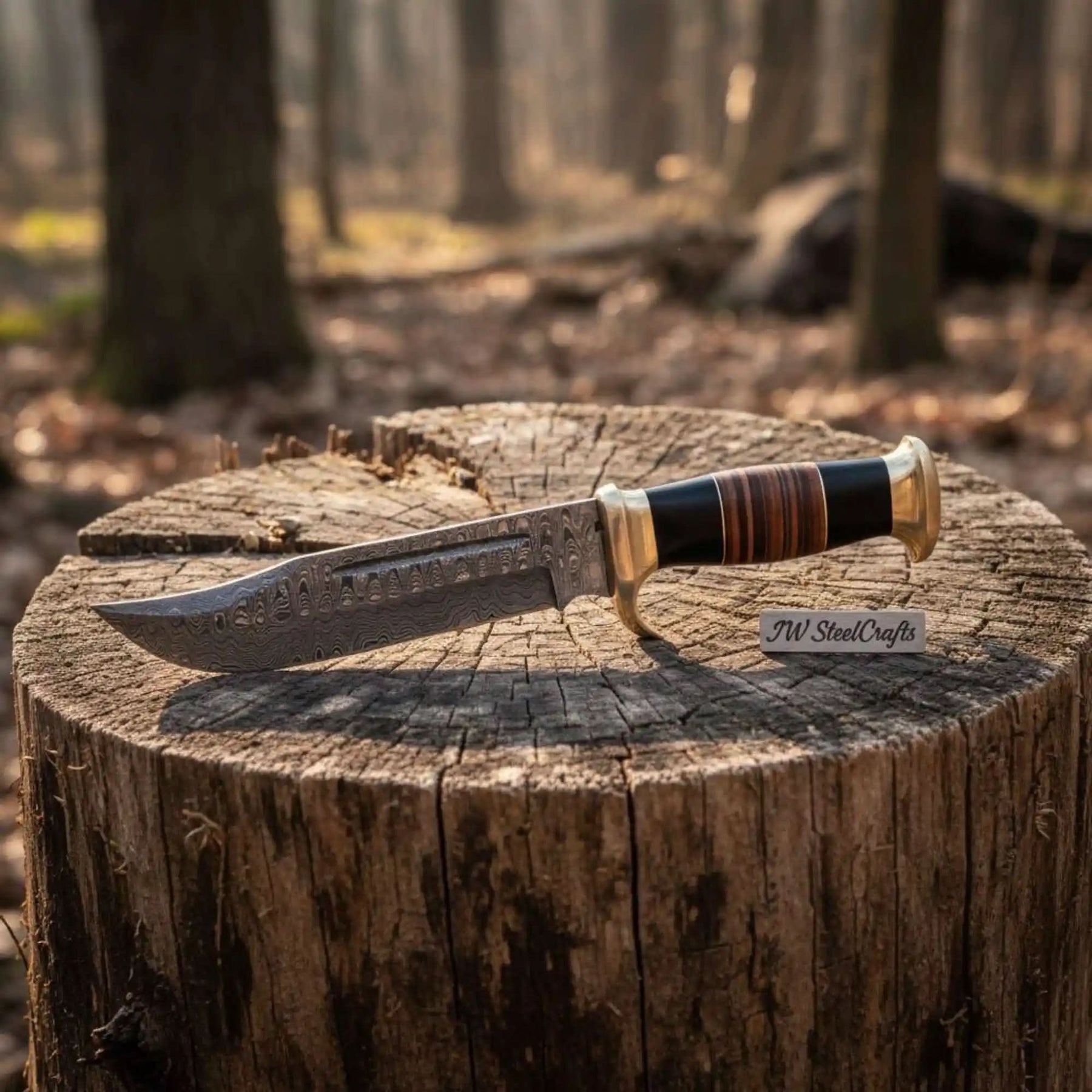 Handmade damascus steel knife with resin handle on dark surface