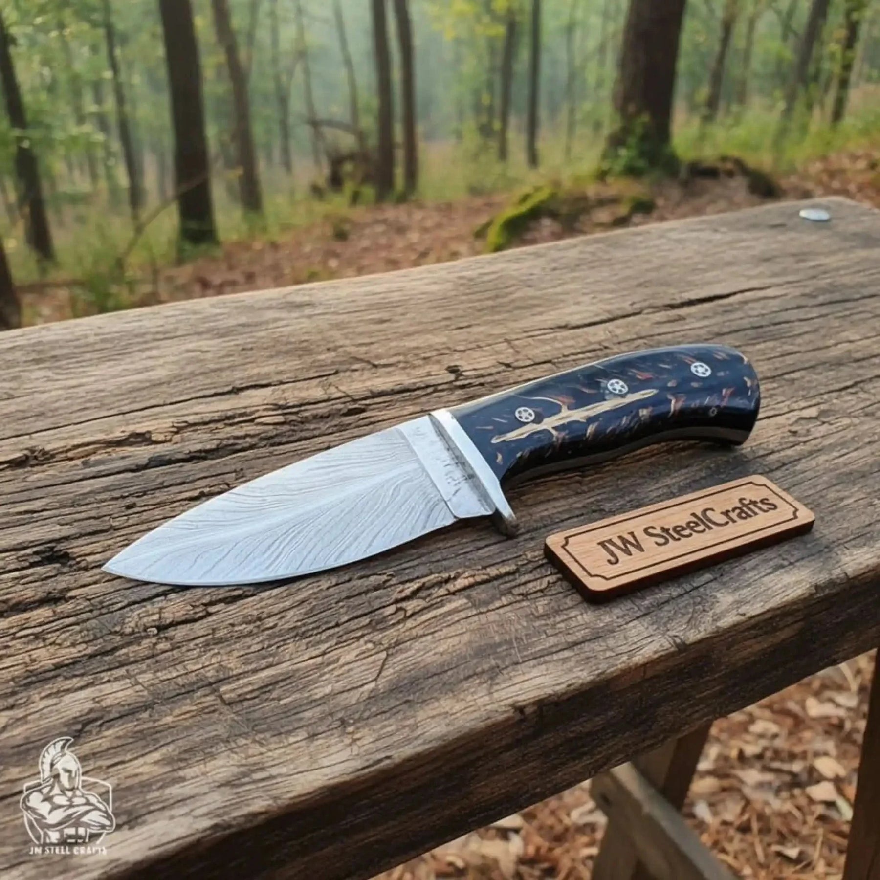 Handmade damascus steel knife with resin handle on dark surface