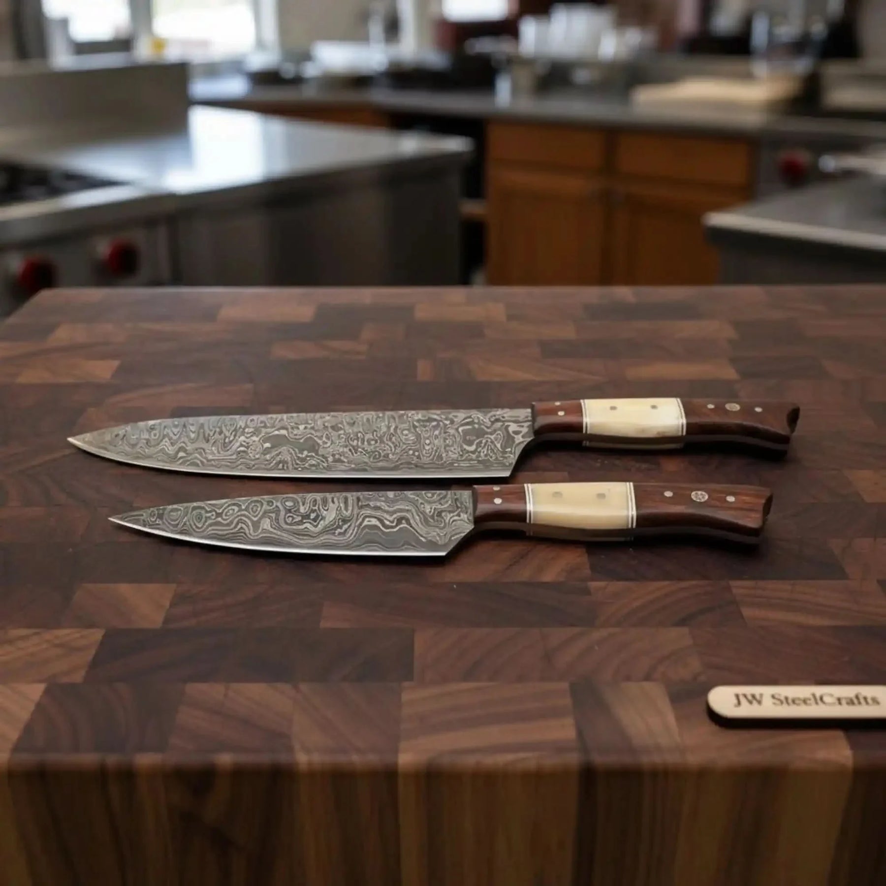 Handmade damascus steel knife with wood handle on dark surface