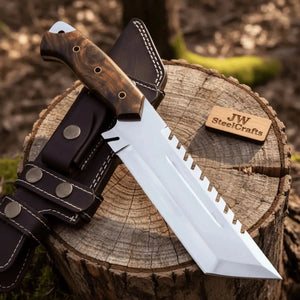 Handmade stainless steel steel knife with wood handle on dark surface