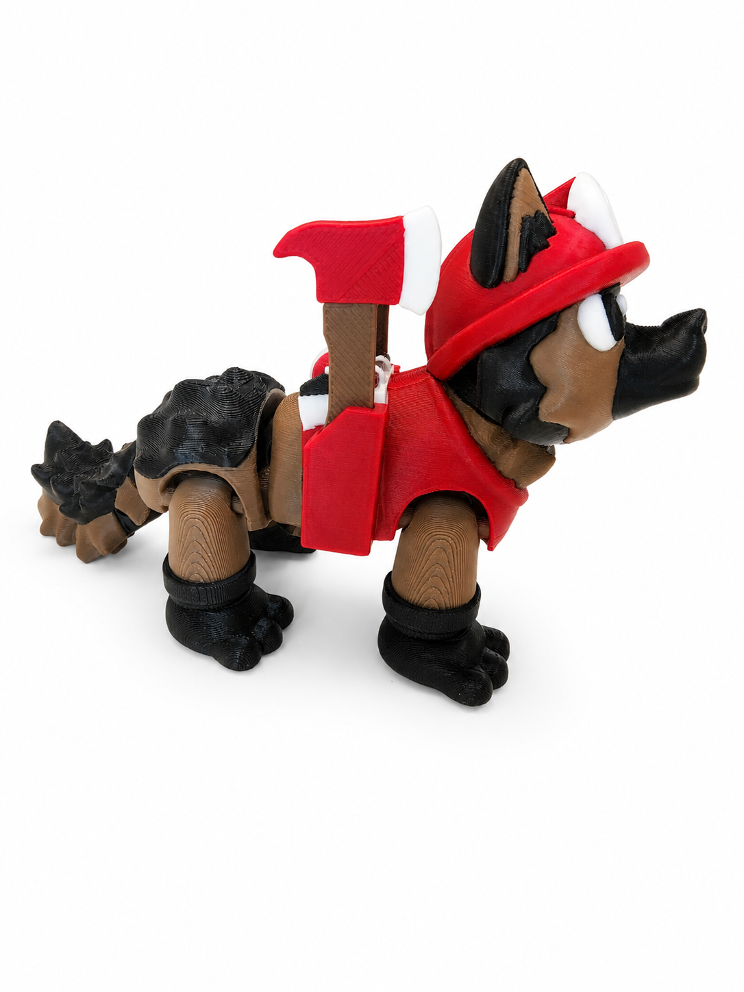 Profile view of The Tween Space firefighter dog 3D printed toy with red harness and two removable axes