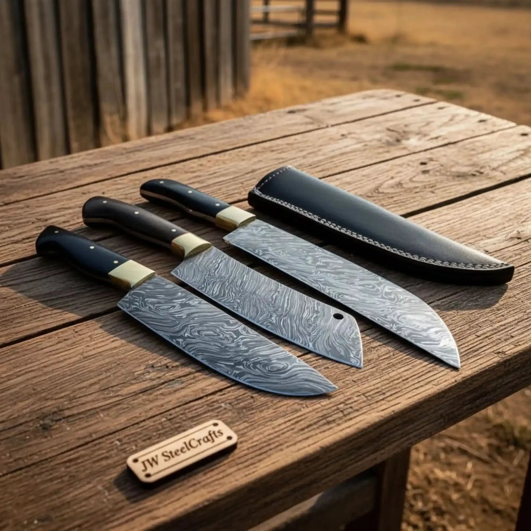 Handmade damascus steel knife with premium handle on dark surface