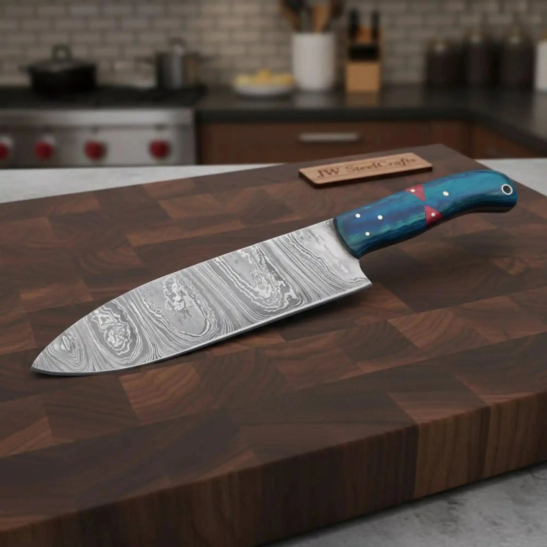 Handmade damascus steel knife with wood handle on dark surface
