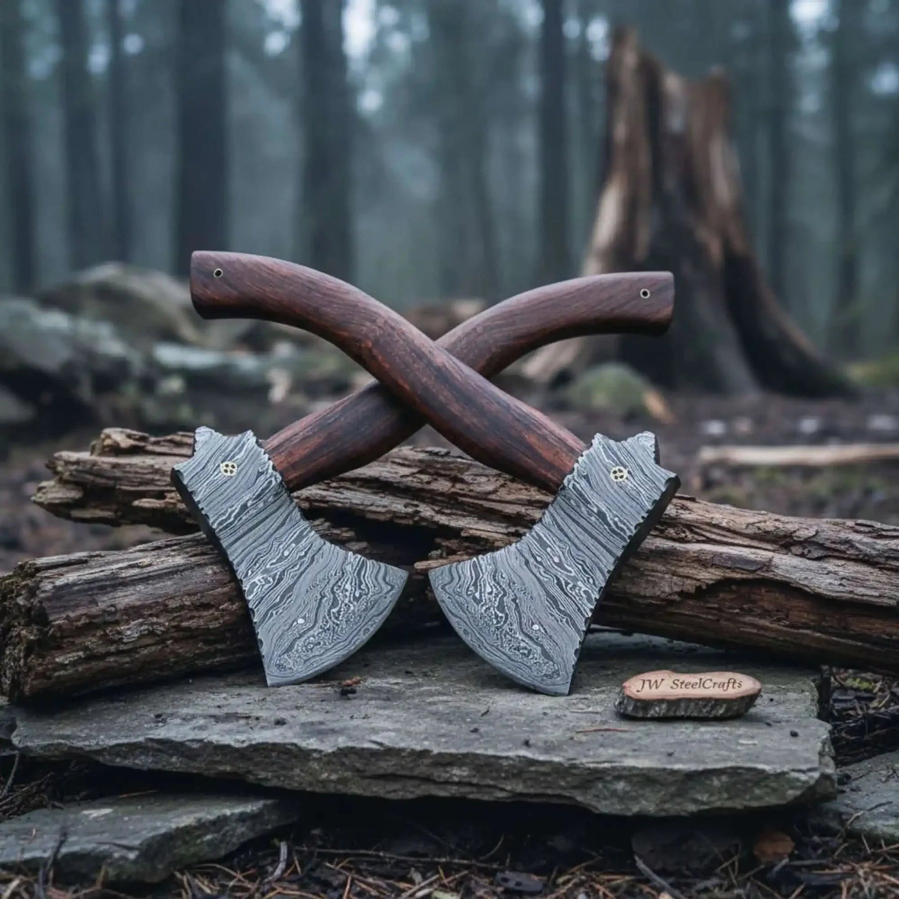 Damascus steel axe head with wood handle on rustic wood surface