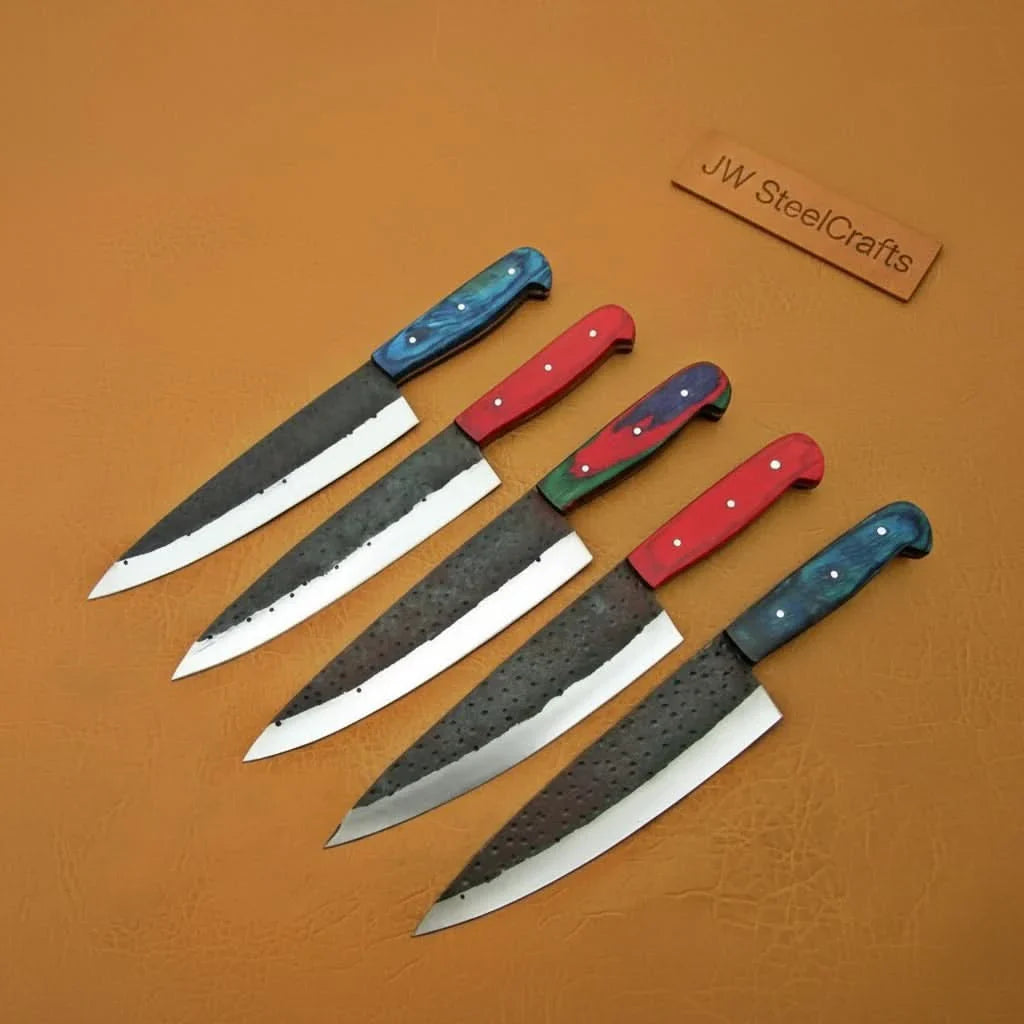 Handmade carbon steel steel knife with wood handle on dark surface
