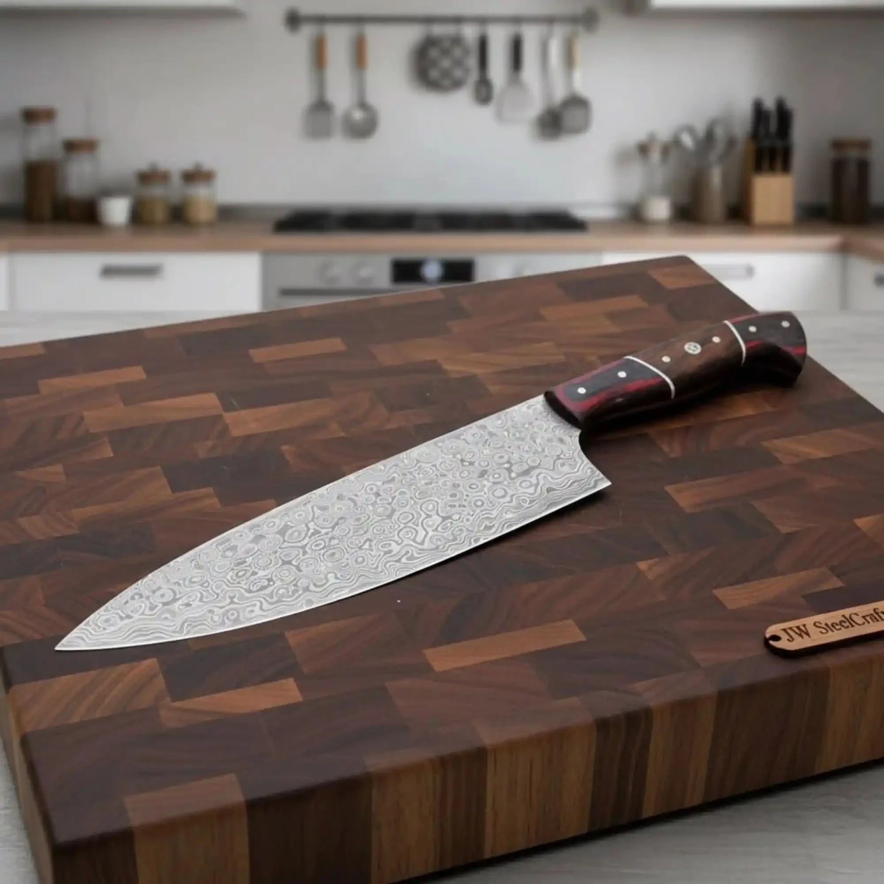Handmade damascus steel knife with wood handle on dark surface