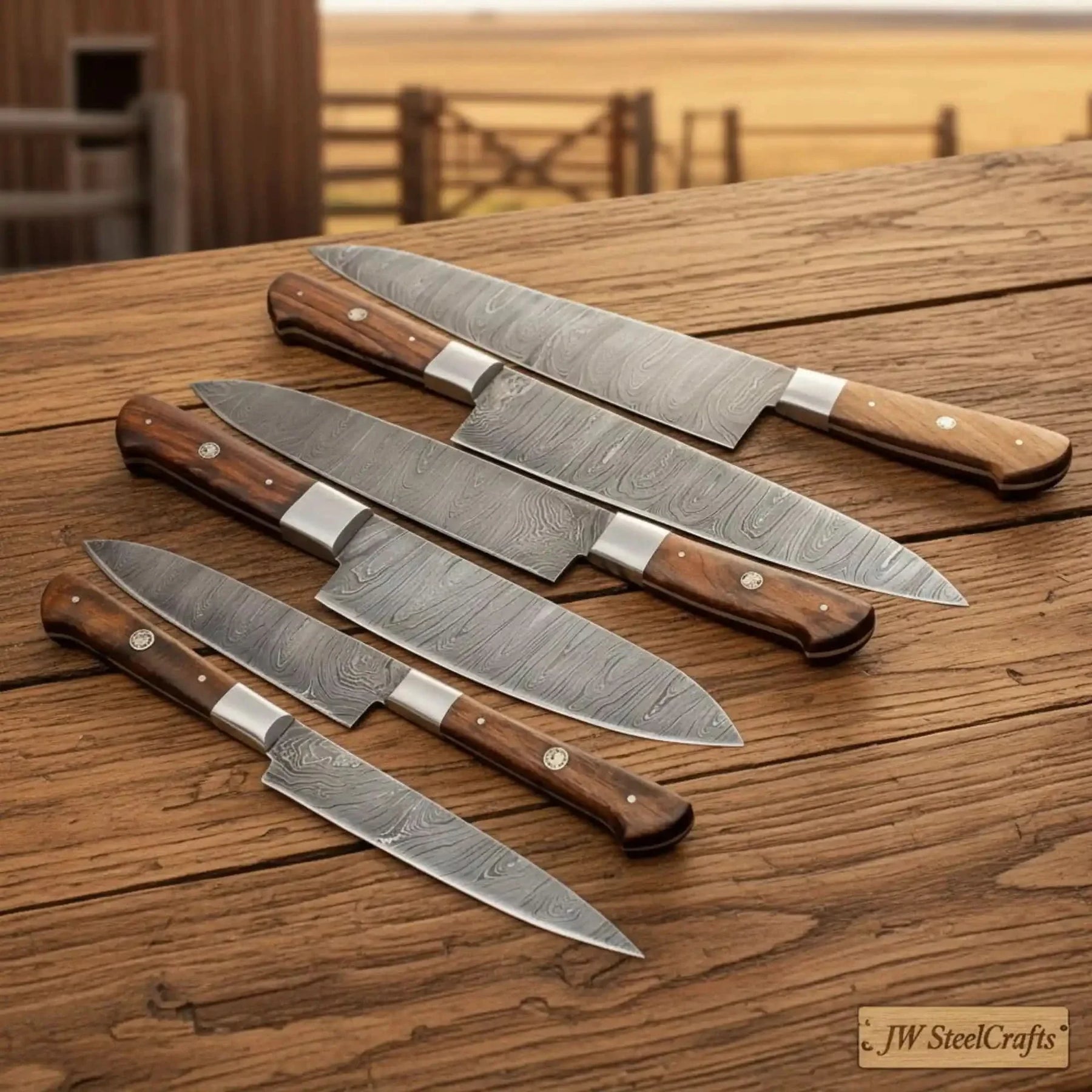 Handmade damascus steel knife with wood handle on dark surface