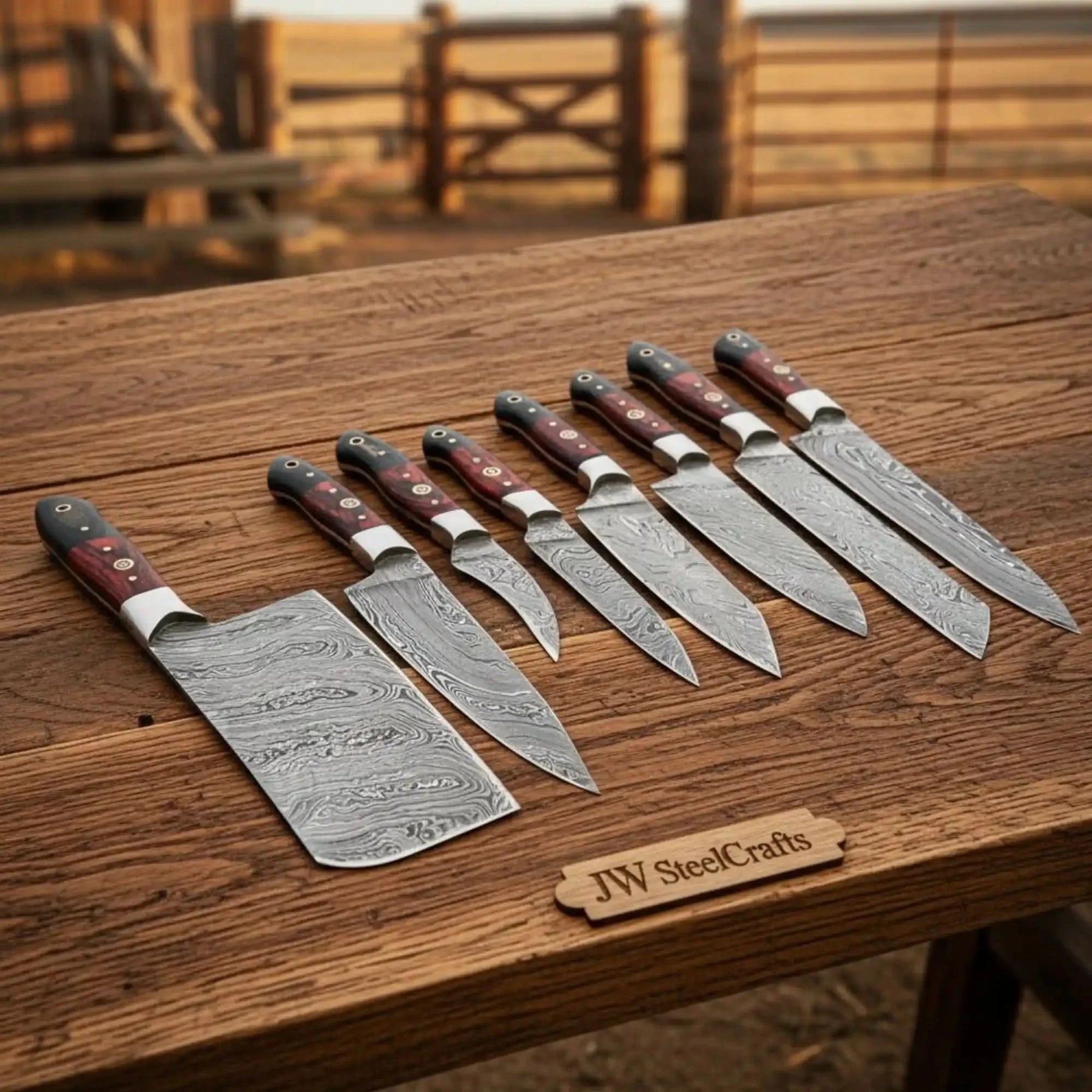 Handmade damascus steel knife with premium handle on dark surface