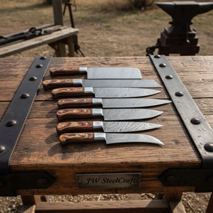 Handmade damascus steel knife with premium handle on dark surface